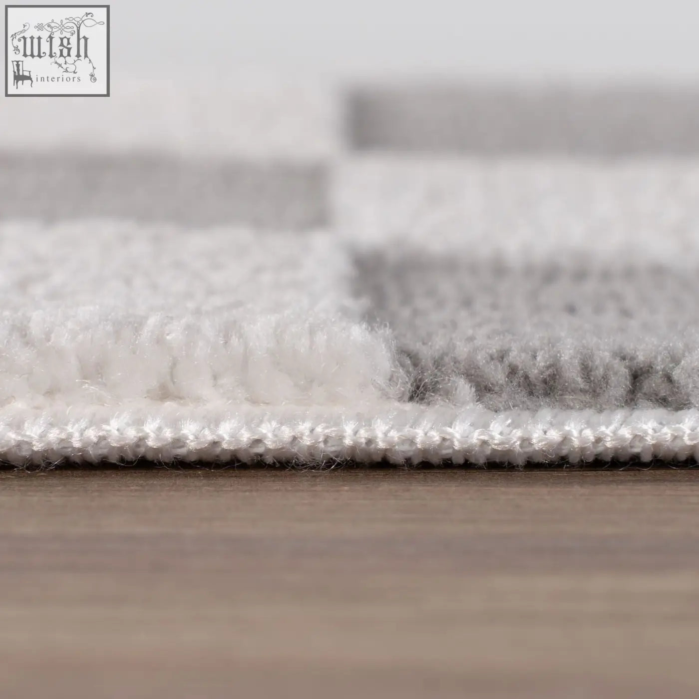 A plush white and gray striped loft checkerboard grey rug with soft textured pile perfect as a cozy grey rug