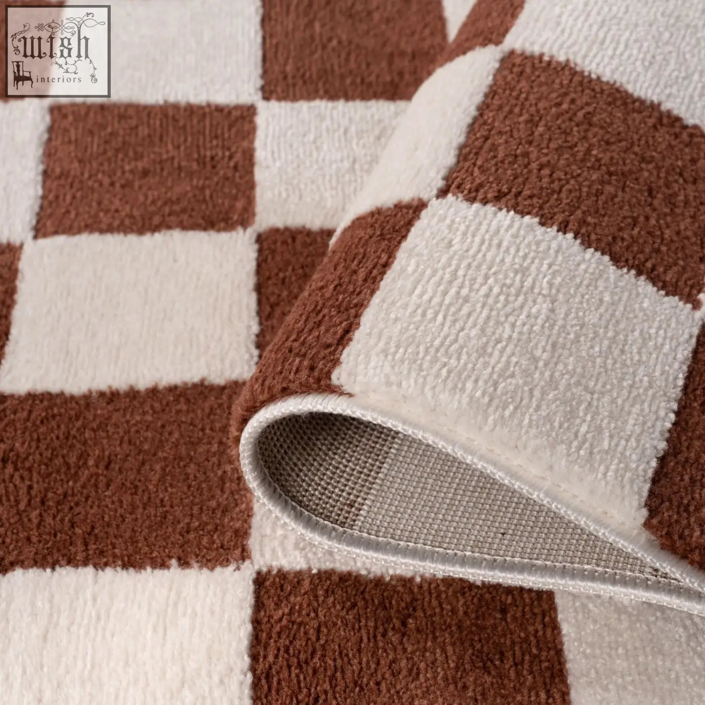 A plush brown and cream checkered bath mat with a soft textured surface called loft checkerboard terra rug