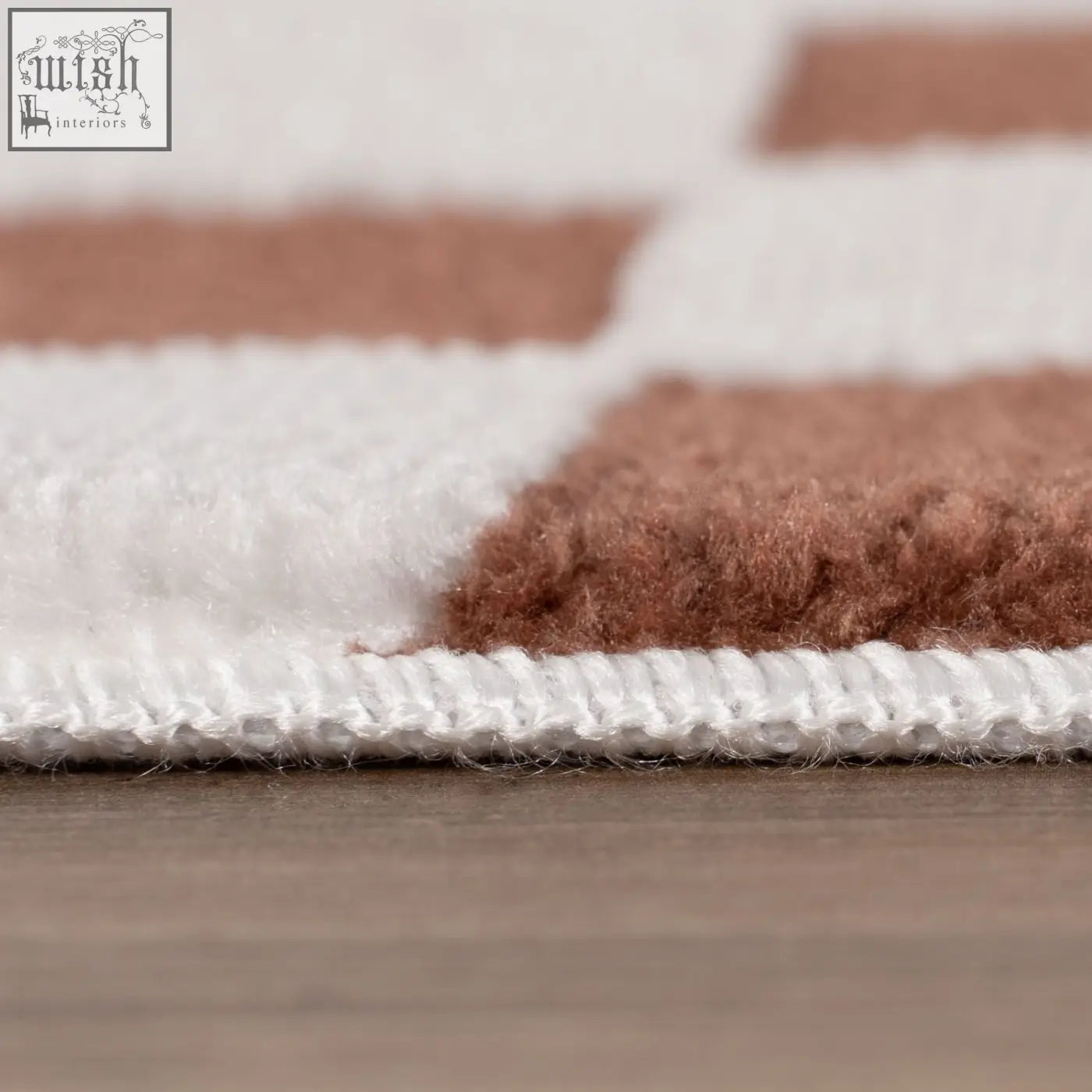 A plush textured loft checkerboard terra rug with alternating white and warm brown rectangular blocks