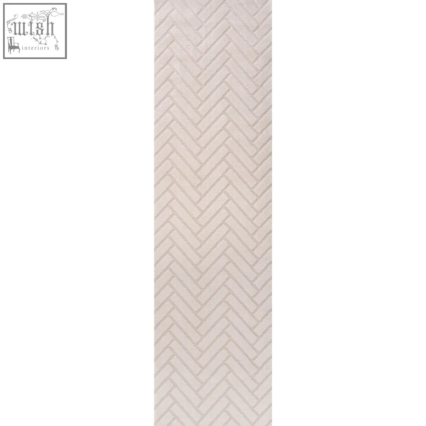 A beige herringbone-patterned tile with a subtle texture featured in the loft chevron cream rug design