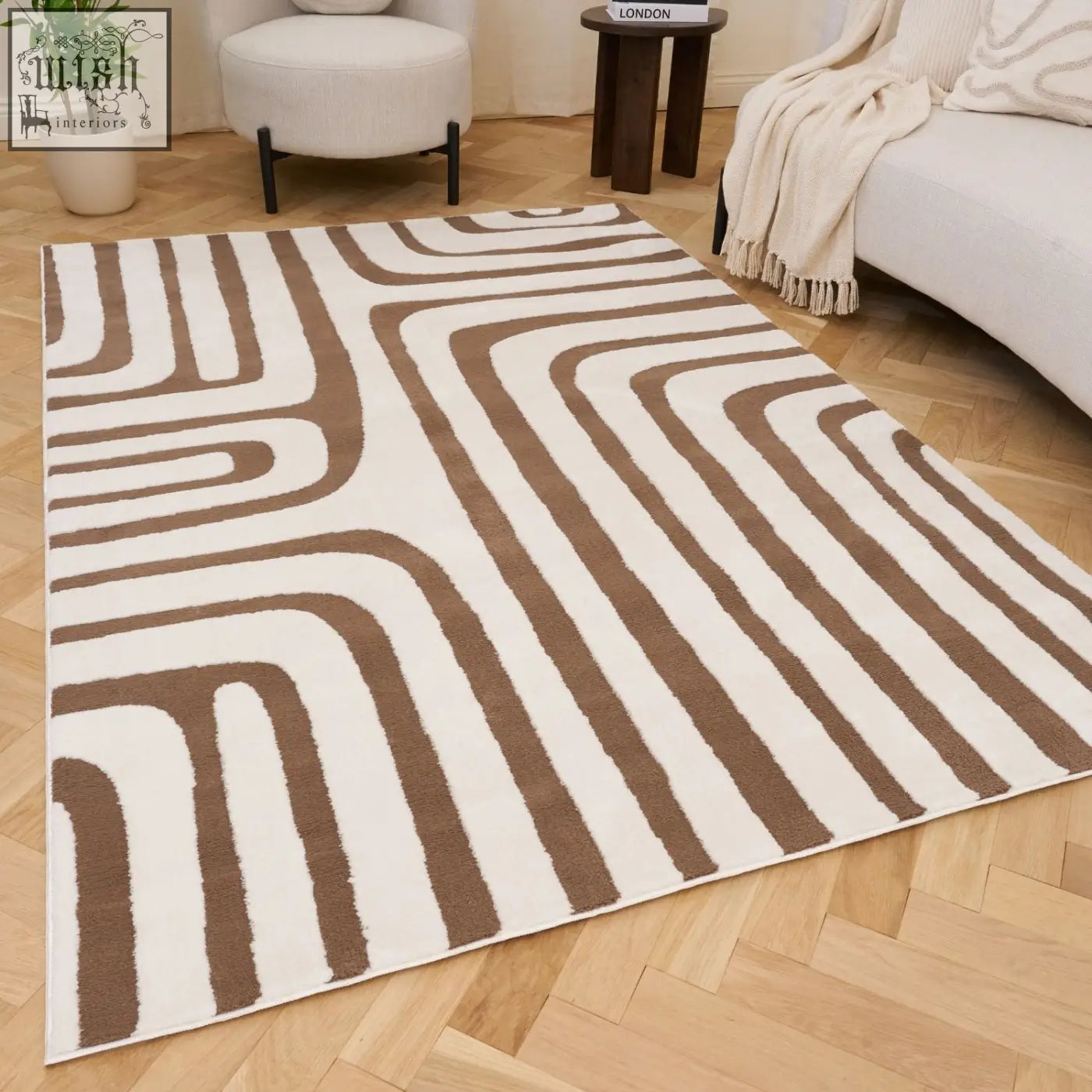 A modern loft geometric brown rug with bold flowing stripes on a light wood floor perfect for any room