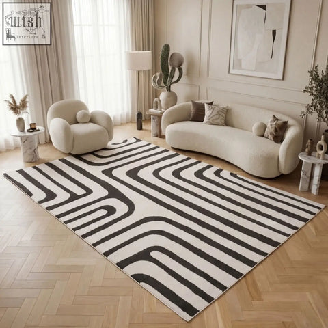 A modern dark grey rug with bold flowing wavy stripes perfect for loft style spaces