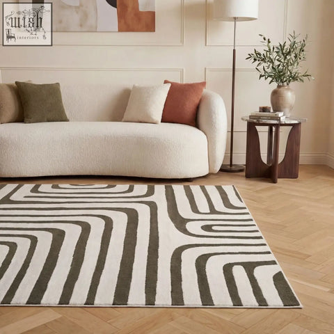 Modern loft geometric green rug with soft textured surface and flowing black and white stripe design