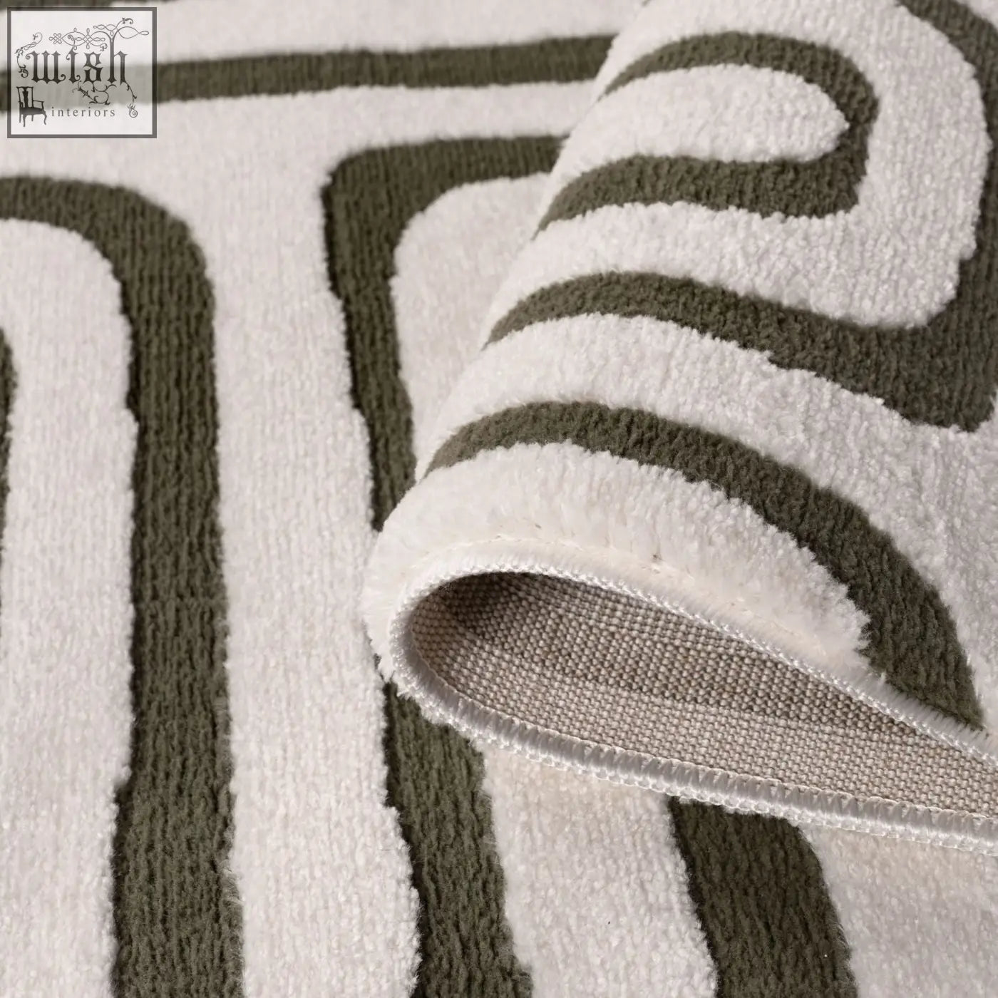 A plush white and olive green loft geometric green rug with a soft textured surface perfect for bathroom floors