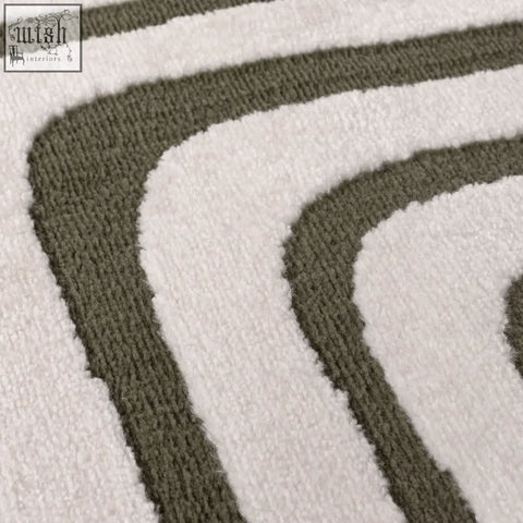 White and olive green striped plush bath mat with textured surface in loft geometric green rug style