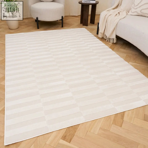 Cream-colored loft striped cream rug with subtle geometric pattern of interlocking horizontal stripes
