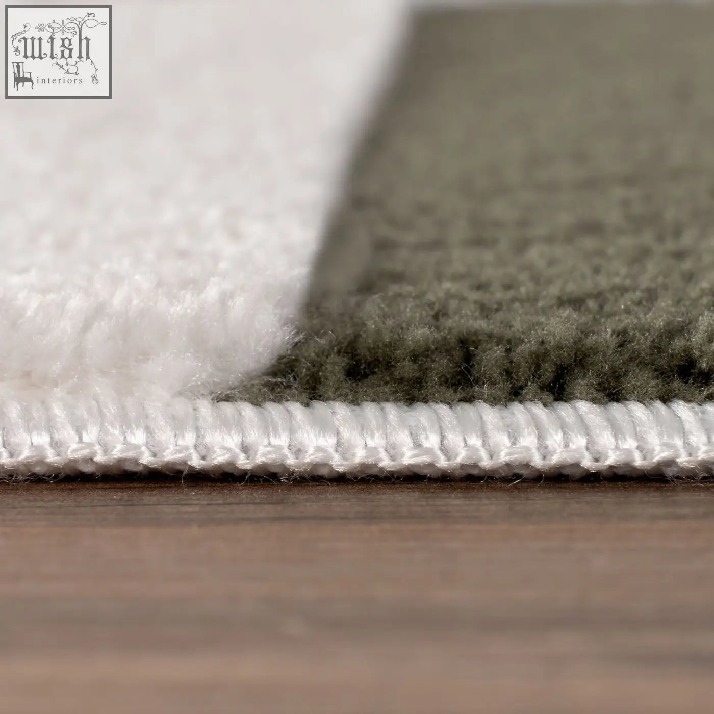Loft striped green rug with soft plush texture featuring white and olive green color blocks and stitched white border