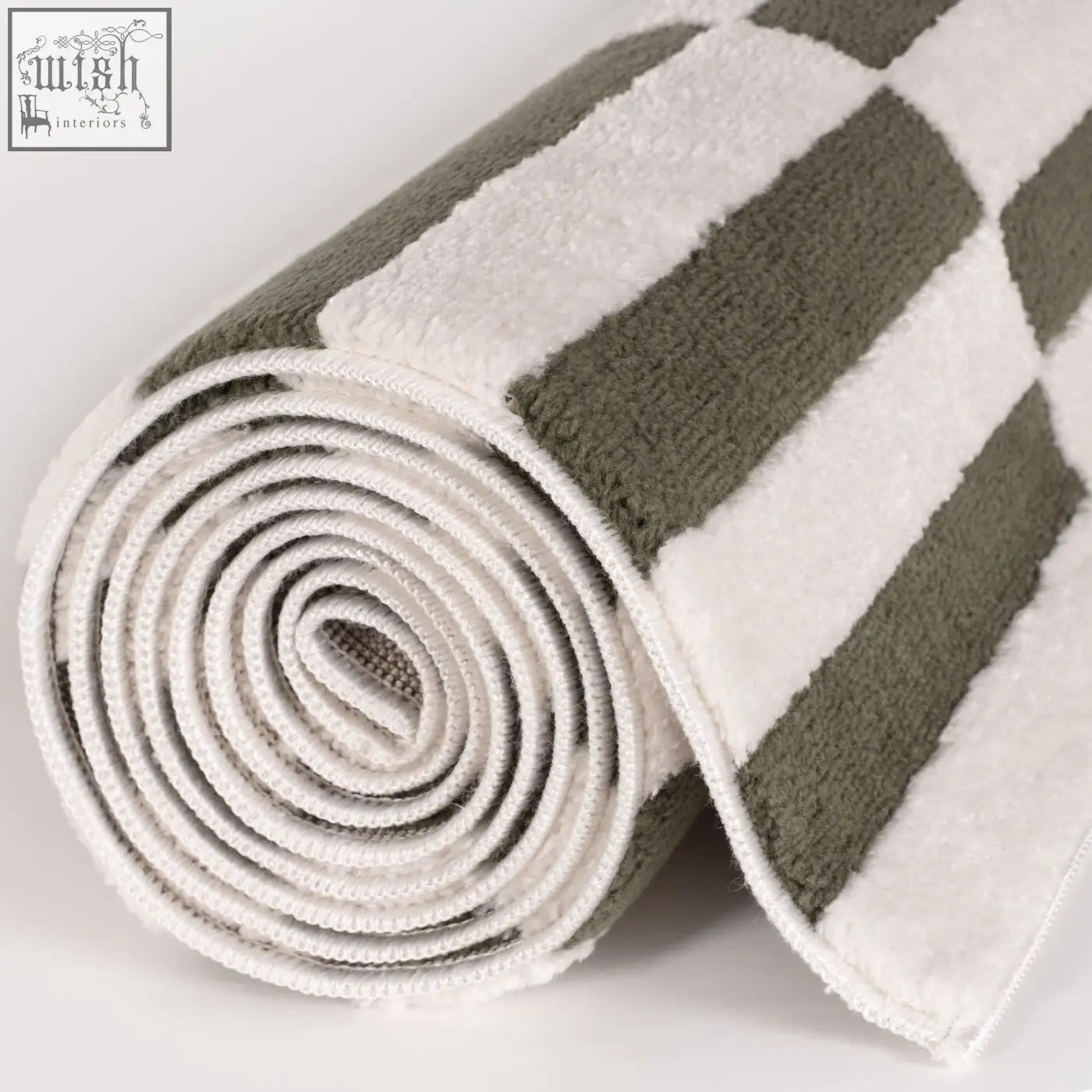 A rolled plush bath towel with olive green and white stripes perfect for loft striped green or striped green rug lovers