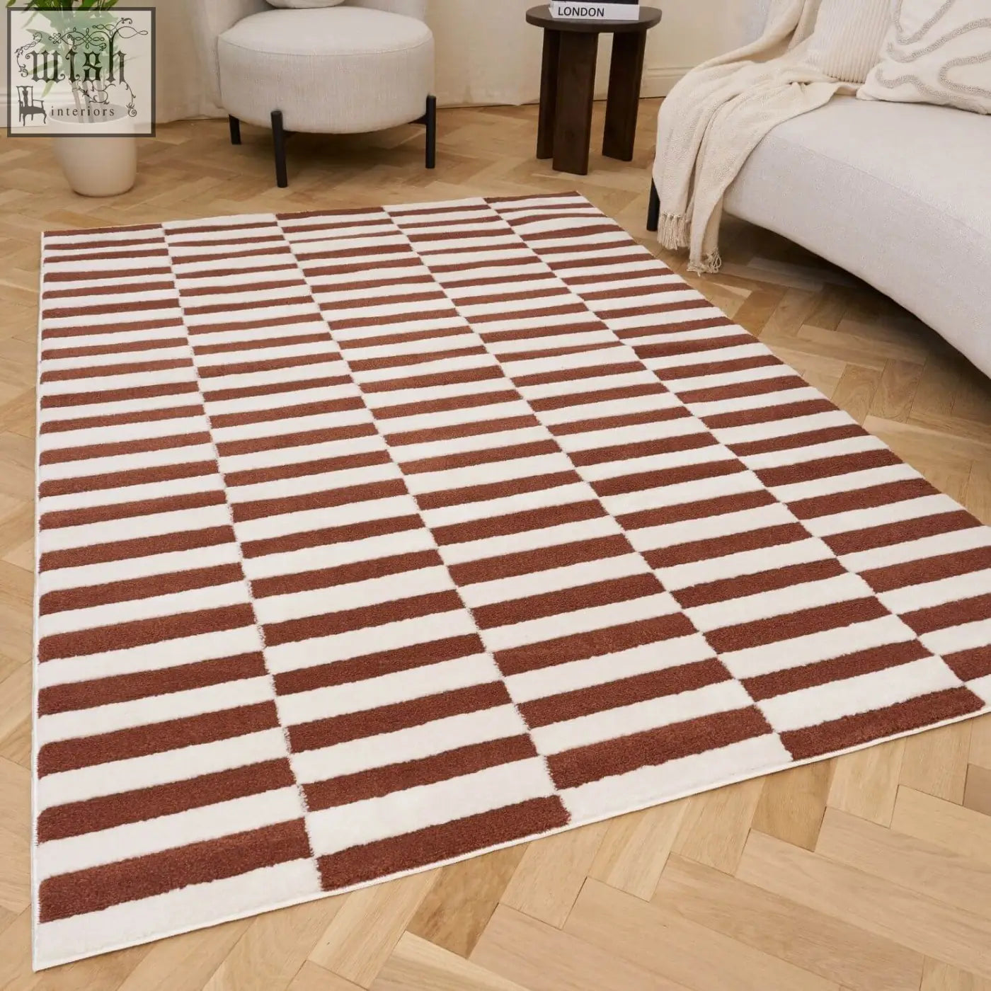 Loft striped terra rug with bold brown and white horizontal stripes on a light wood floor for cozy spaces