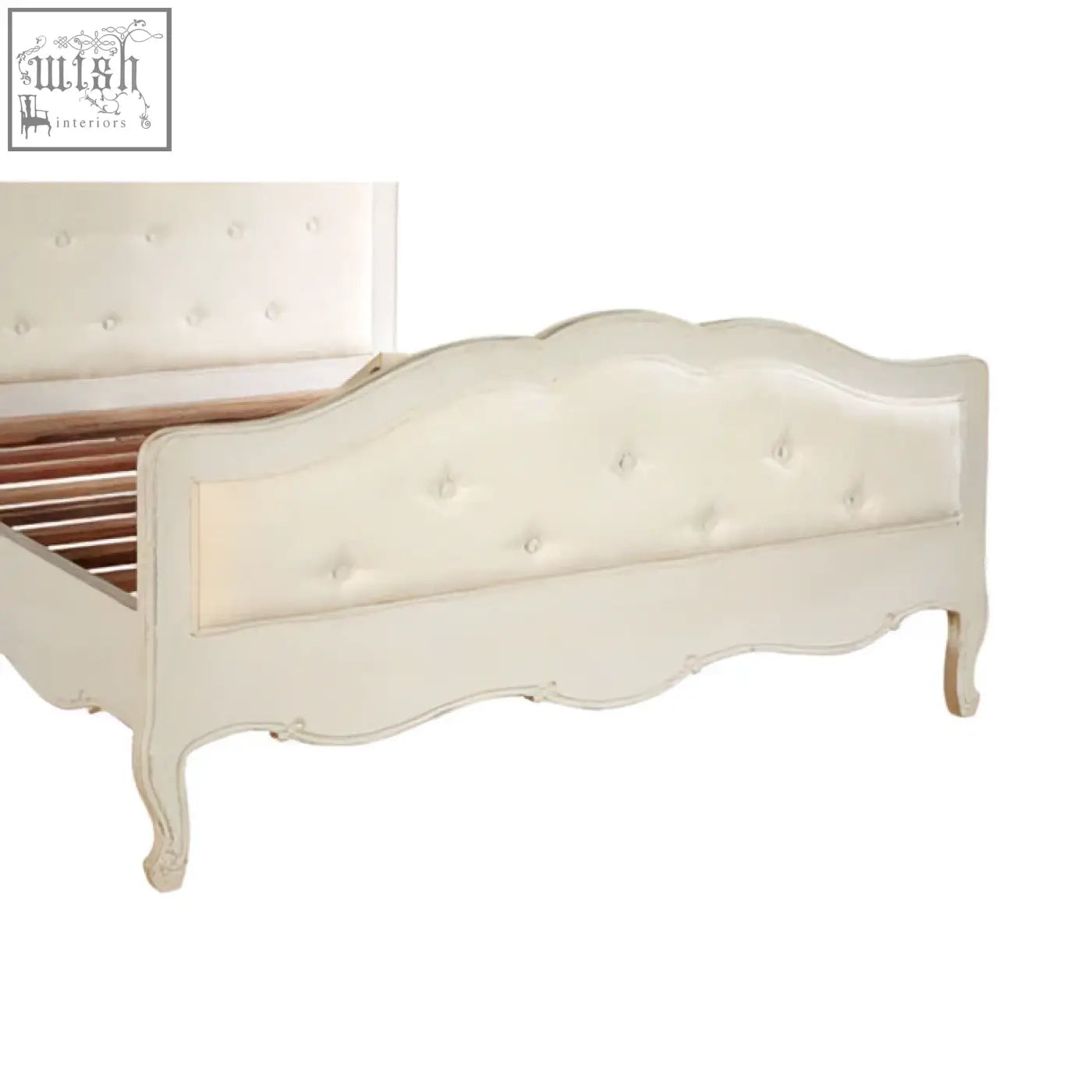Cream-colored tufted white double bed with ornate curved legs and classic elegant design perfect for any bedroom