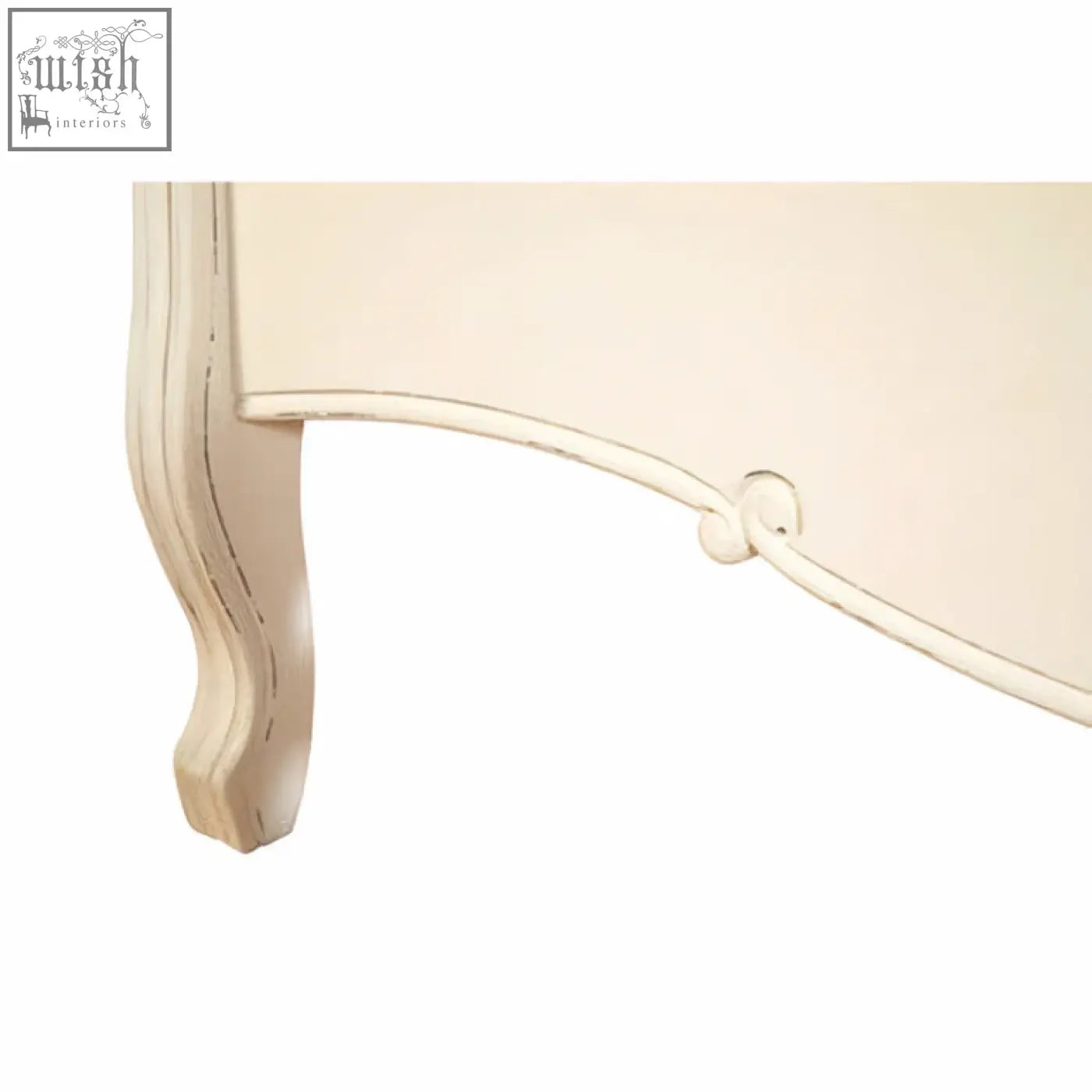 Cream-colored distressed bayur wood leg with elegant curves on loire white kingsize white kingsize bed frame