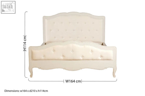 Cream-colored loire white kingsize bed with tufted frame and ornate bayur wood curved legs and matching headboard