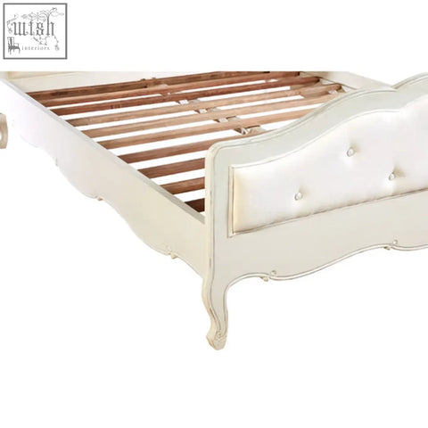 Loire white kingsize white kingsize bed with tufted upholstered headboard and carved bayur wood legs