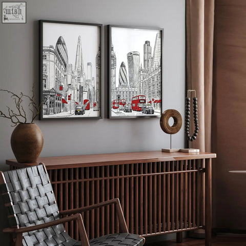 Two framed london abstract art prints in black white and red featuring city skyline and double-decker buses