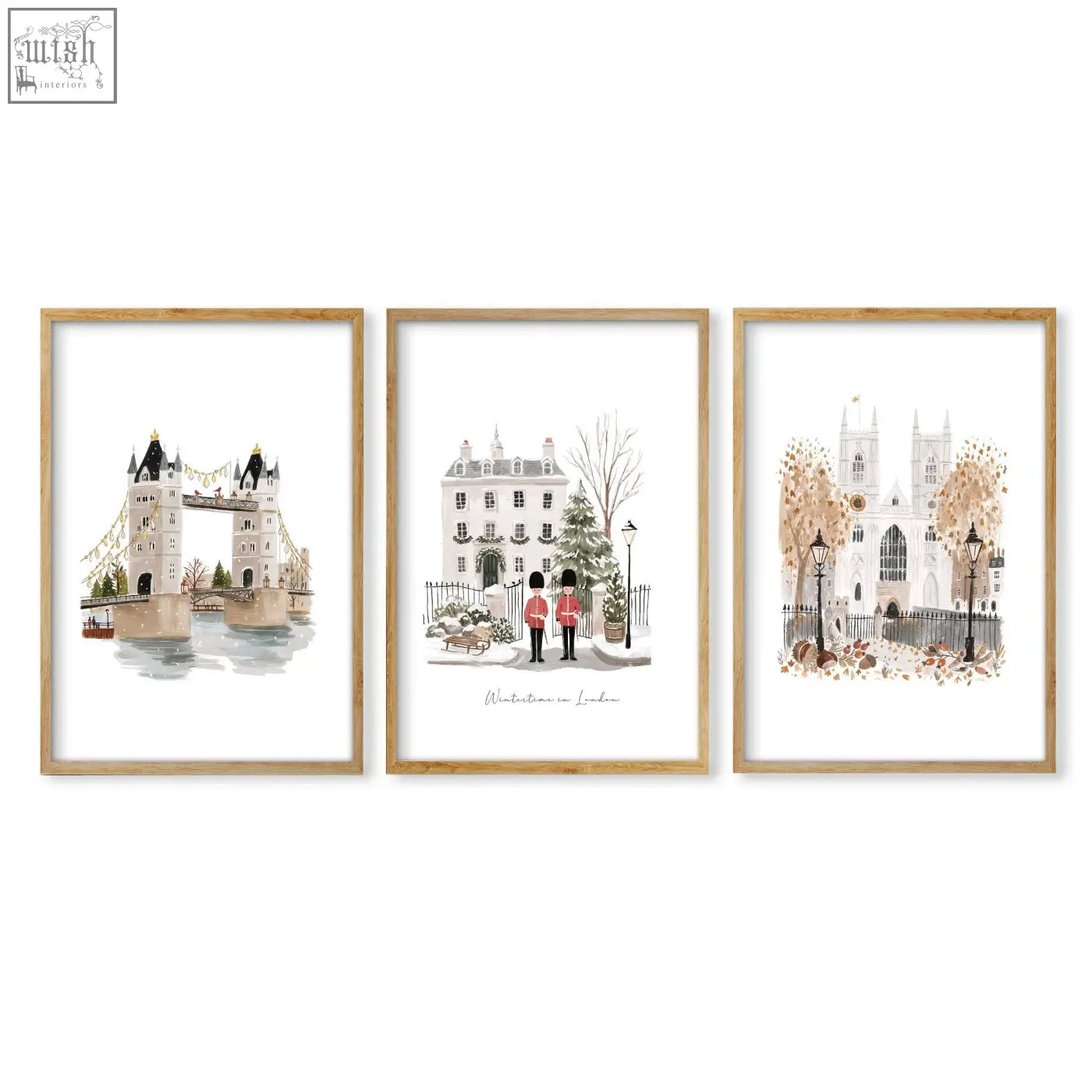 Set of three london art prints featuring watercolor wintertime landmarks in soft tones with light wood frames wall art