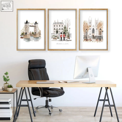 Three framed london art prints featuring wintertime landmarks in light wood frames perfect for wall art decor