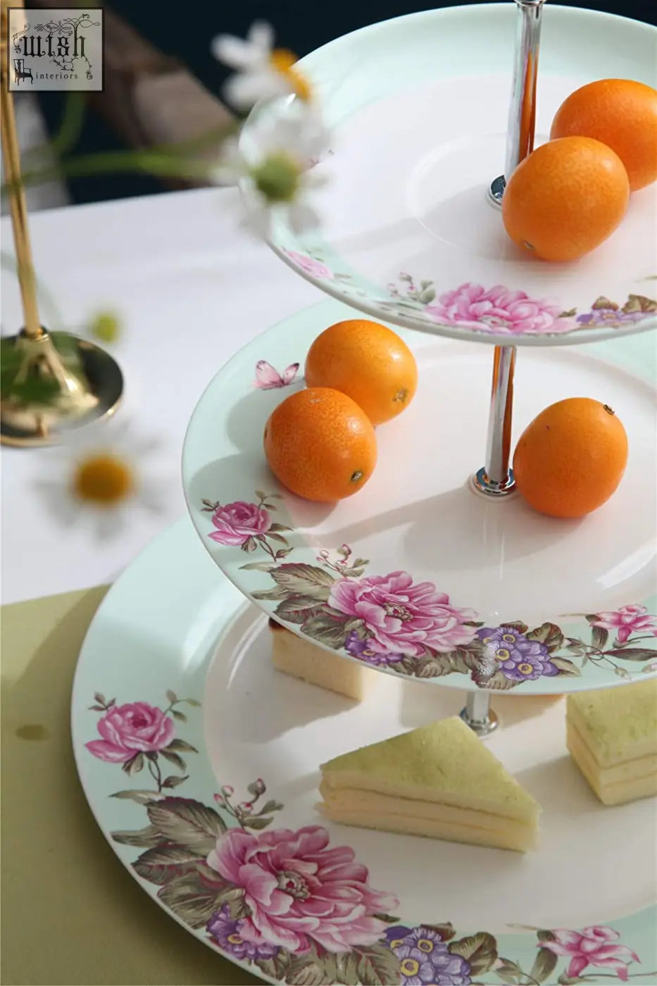 Three-tiered porcelain cake stand with pink floral bird and butterfly design from london boutique in turquoise gift box
