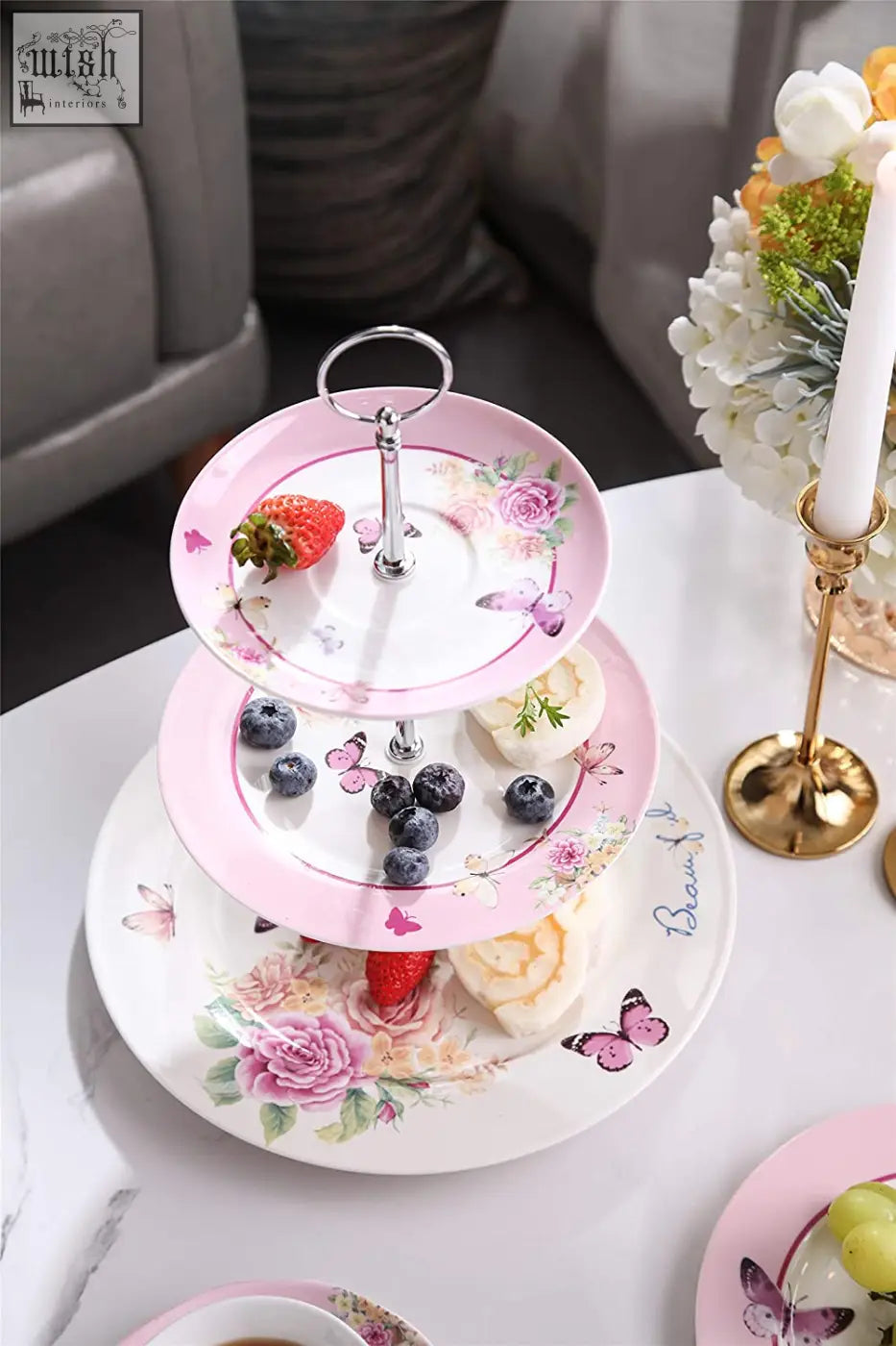 Pink floral and butterfly patterned three tiered ceramic cake stand from london boutique perfect for afternoon tea