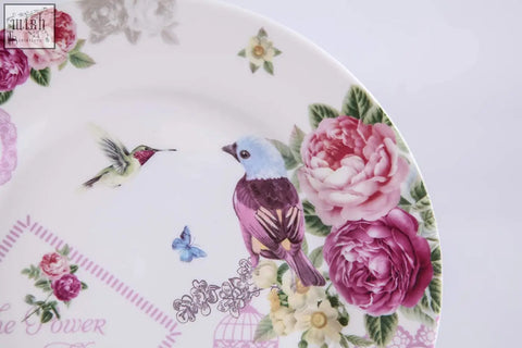 White ceramic cake plate with vibrant pink roses blue and purple birds in bird rose butterfly design shabby chic style