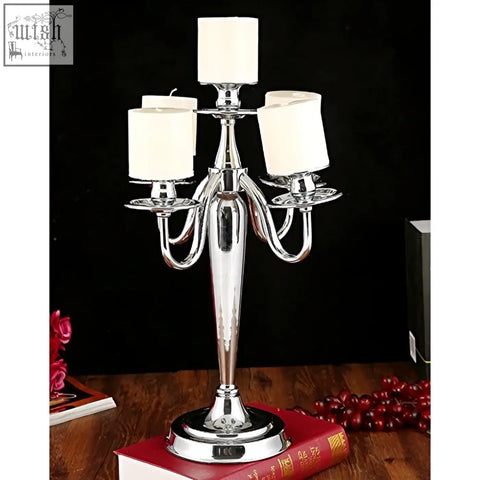 Shiny chrome five armed solid brass arms candelabra from london boutique perfect for wedding or birthday centerpieces