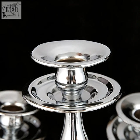 Shiny silver solid brass arms candelabra from london boutique with flared bowl and tiered base for weddings and gifts