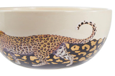 Cream-colored ceramic london leo large bowl with detailed leopard illustration and elegant tail curling around the rim