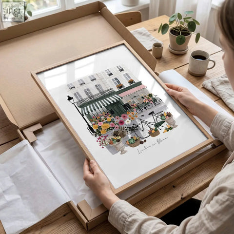 A framed london poster art print of a parisian street scene with colorful flowers and bicycles in pastel tones wall art