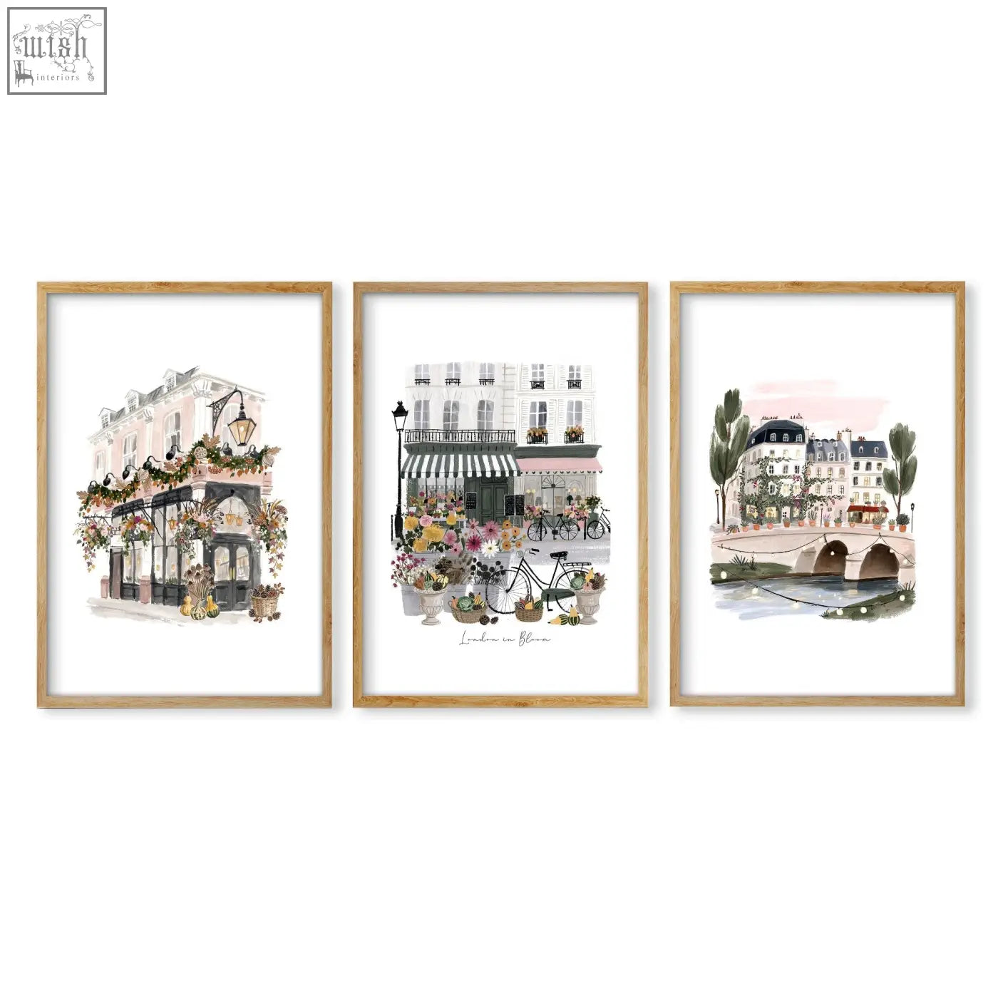 Three framed parisian street scene art prints in light wood frames with white matting perfect london poster wall art