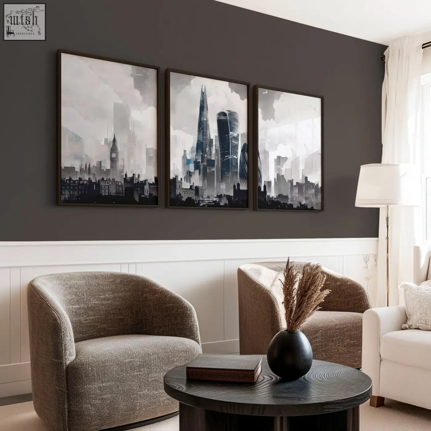 Black ceramic vase with dried pampas grass beside a set of 3 london prints featuring moody grey london skyline