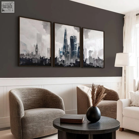 Black ceramic vase with dried pampas grass beside a set of 3 london prints featuring moody grey london skyline