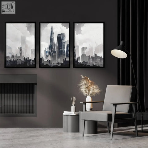 Gray upholstered armchair with dark wood frame next to london prints set of three featuring the moody grey skyline