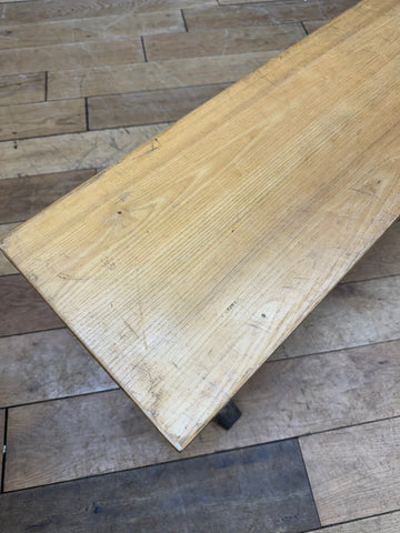 Long vintage oak school bench seat with rustic light wood finish and visible grain perfect for leys school hallway seating