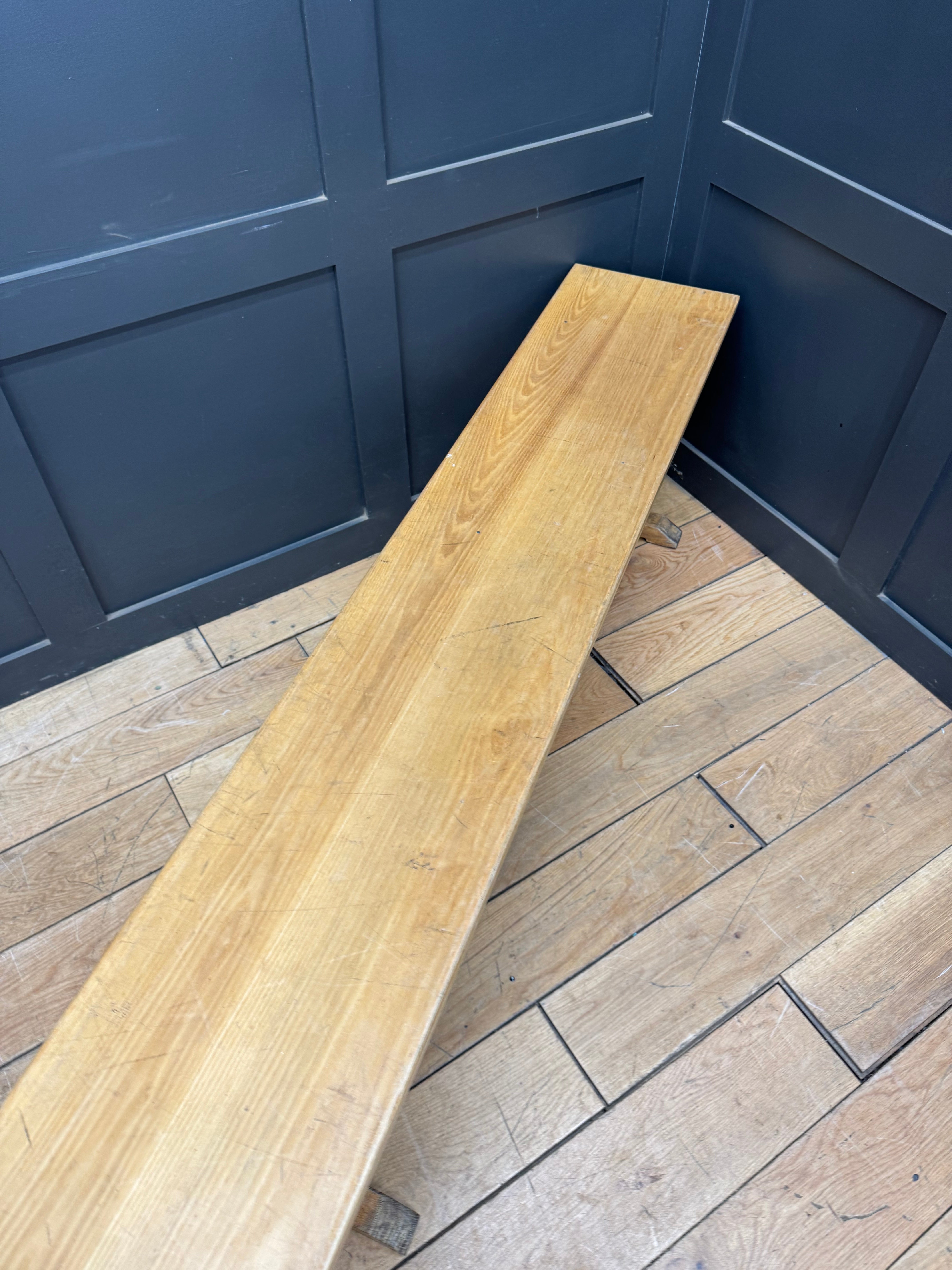 Light-colored long vintage oak school bench seat with smooth natural finish and visible grain for leys school seating