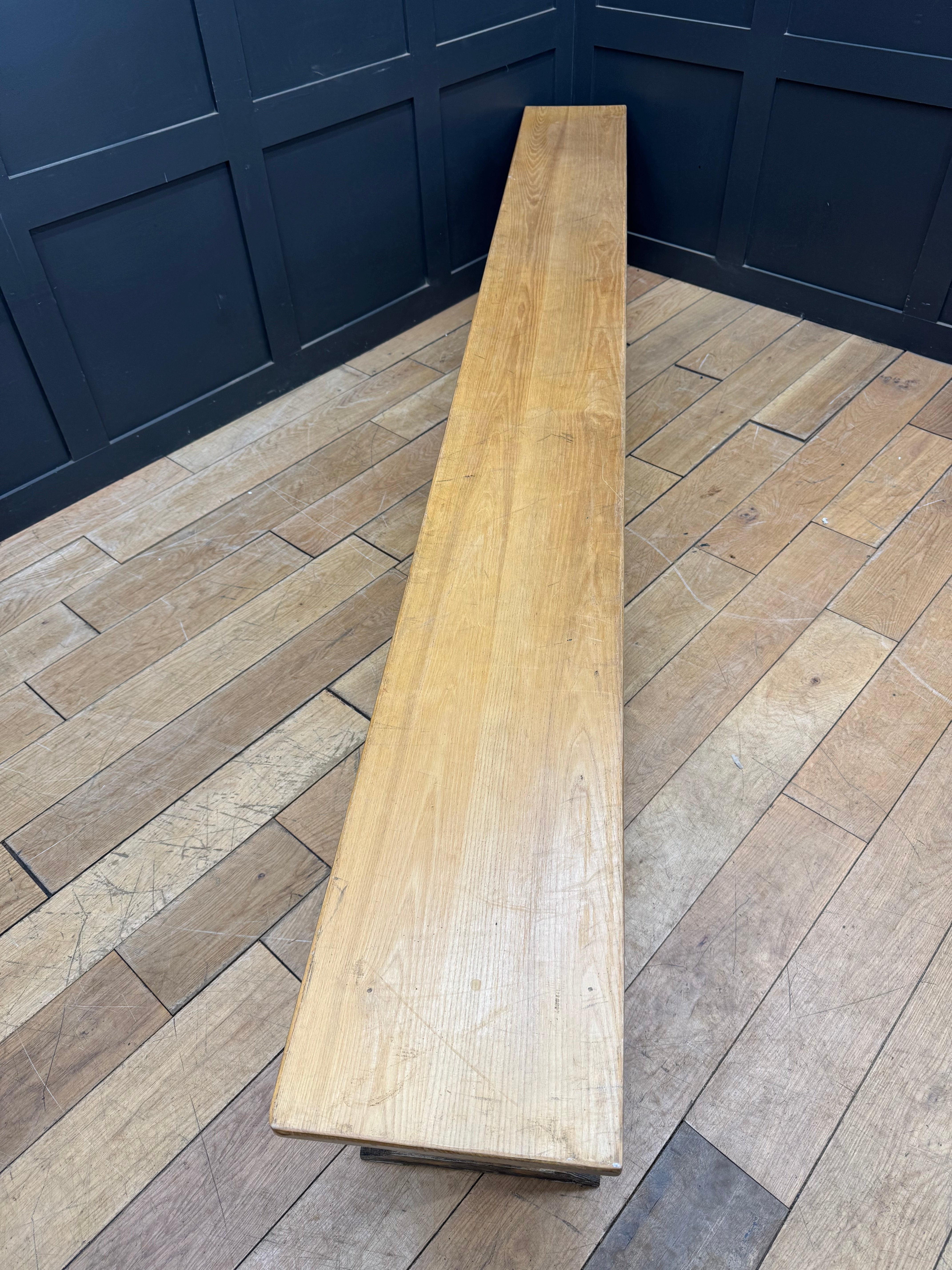 Long vintage oak school bench seat in light oak with smooth finish and visible grain perfect for leys school hallway seating