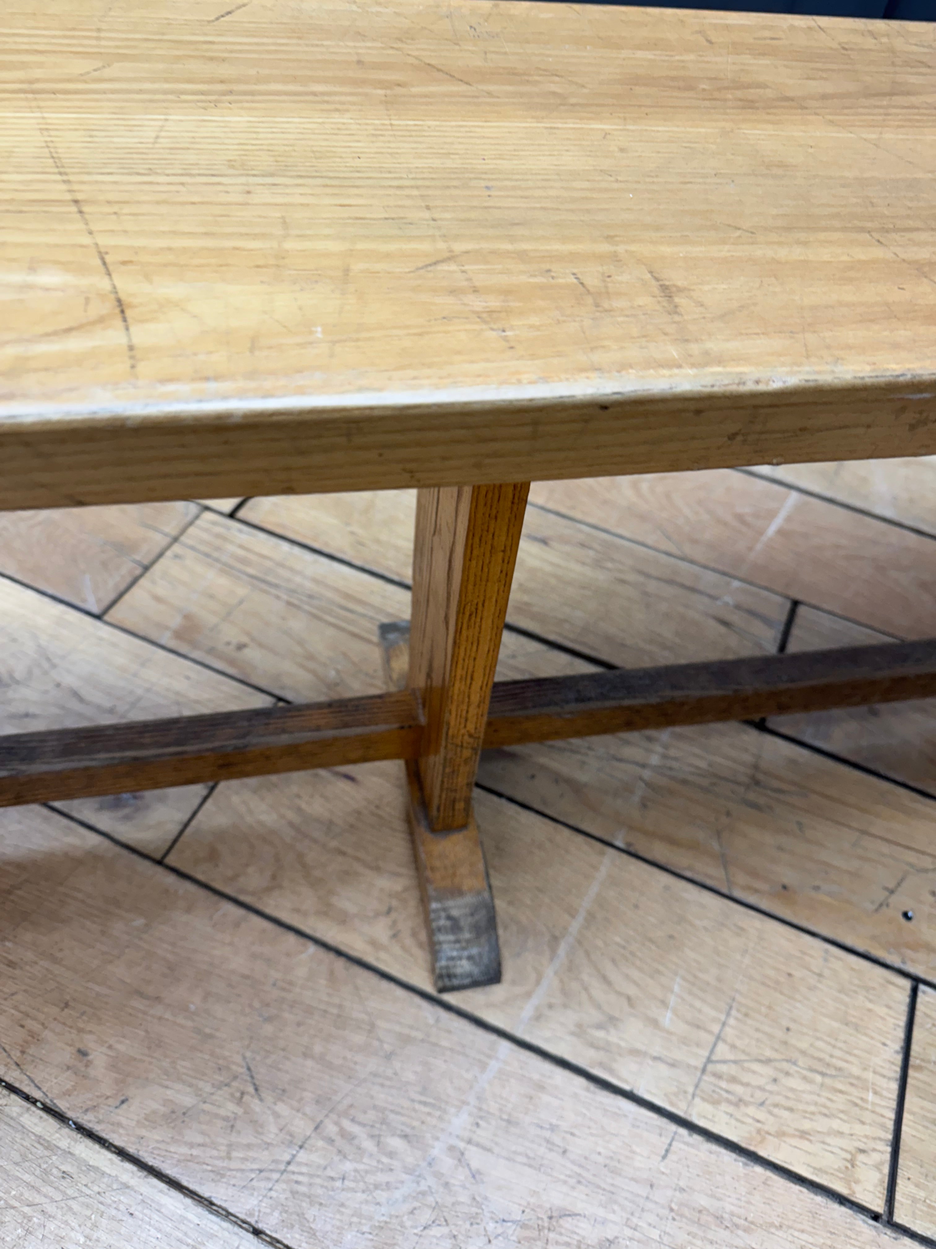 Long vintage oak school bench with rustic weathered finish and visible grain perfect for leys school seating
