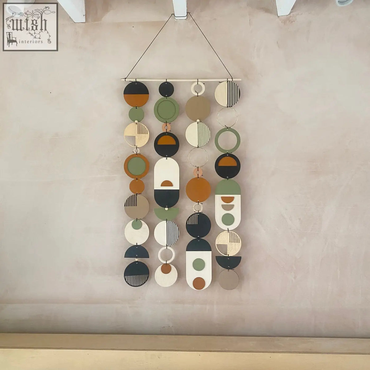 Longer wall art with hand painted engraved wooden discs in earthy tones for minimal modern home decor wall art