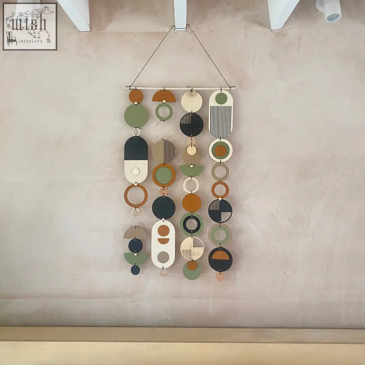 Longer wall art with hand painted engraved geometric shapes in olive green terracotta black and beige for minimal home decor