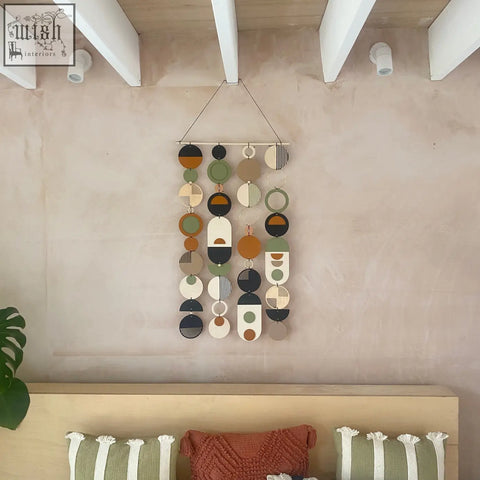 A modern hand painted engraved wall art with olive, terracotta, beige, black, and white geometric shapes in earthy tones