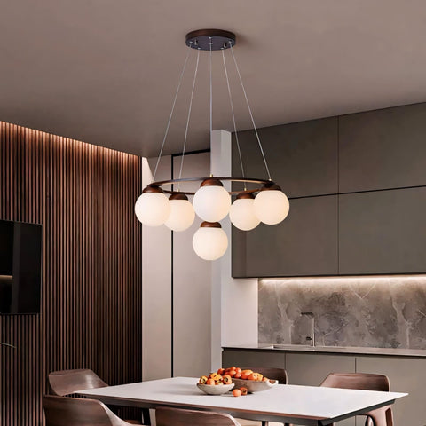 Modern lonian light pendant with circular metal frame and six frosted glass globe bulbs in warm white finish