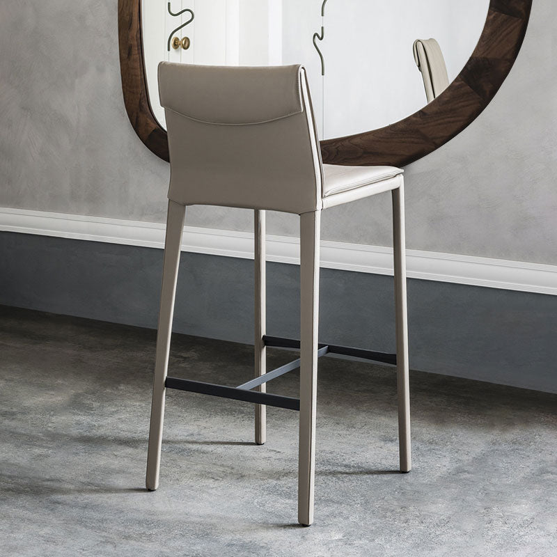 Beige leather lorelei bar stool with sleek metallic legs and minimalist design for modern bar seating