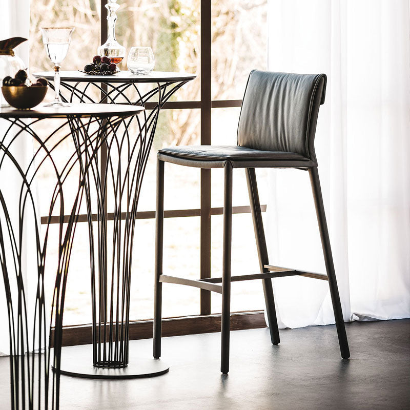 Black leather lorelei bar stool with sleek metal legs and modern minimalist design for stylish seating