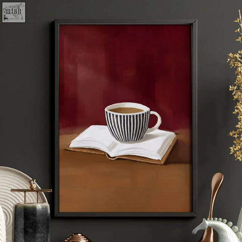 A black and white striped ceramic coffee cup filled with dark liquid on an open book for lounge room wall decor