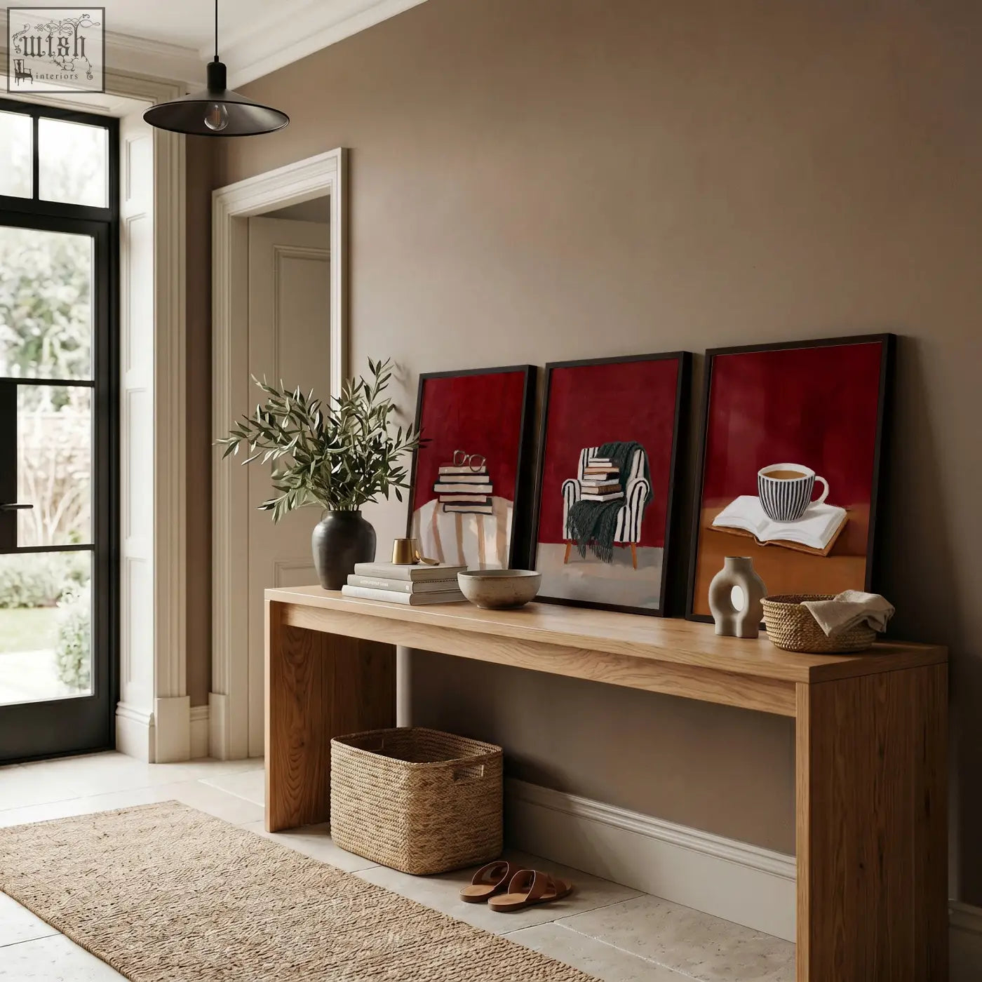 Three framed abstract burgundy art prints with minimalist black and white book lounge room wall decor on wooden table