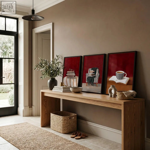 Three framed abstract burgundy art prints with minimalist black and white book lounge room wall decor on wooden table