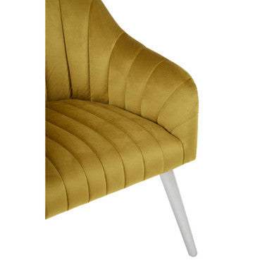 A louxor mustard fabric armchair in velvet with tufted ribbed design and sleek white tapered legs
