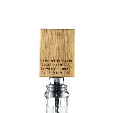 Love and celebrate oak bottle stopper with natural wood grain and engraved repeating phrase in dark lettering