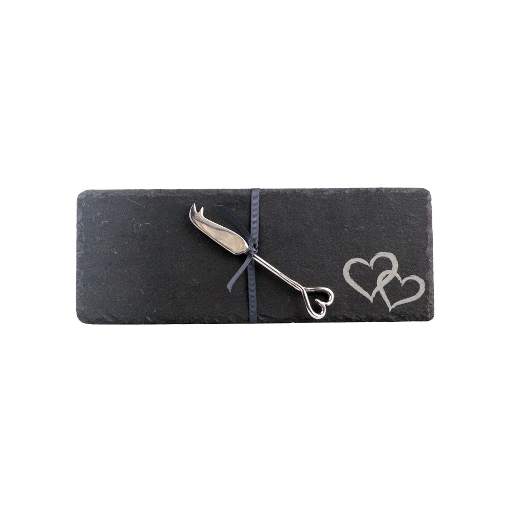 Dark gray mini slate cheese board with love heart engraving and silver cheese knife tied with navy ribbon