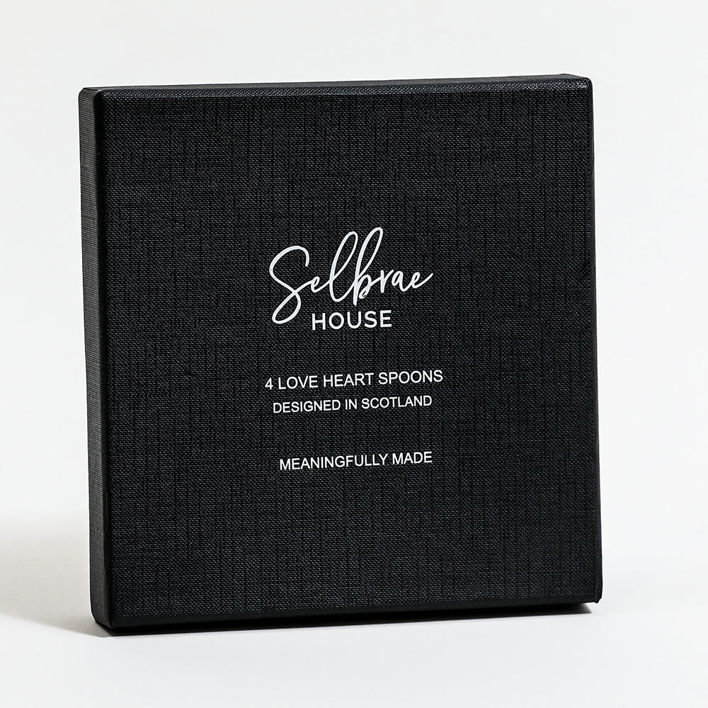Black textured gift box with white selbrae house logo containing four scotland designed love heart spoons set
