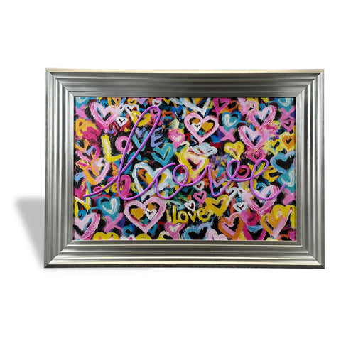 A vibrant framed artwork titled love solves everything with colorful abstract hearts and bold magenta love text