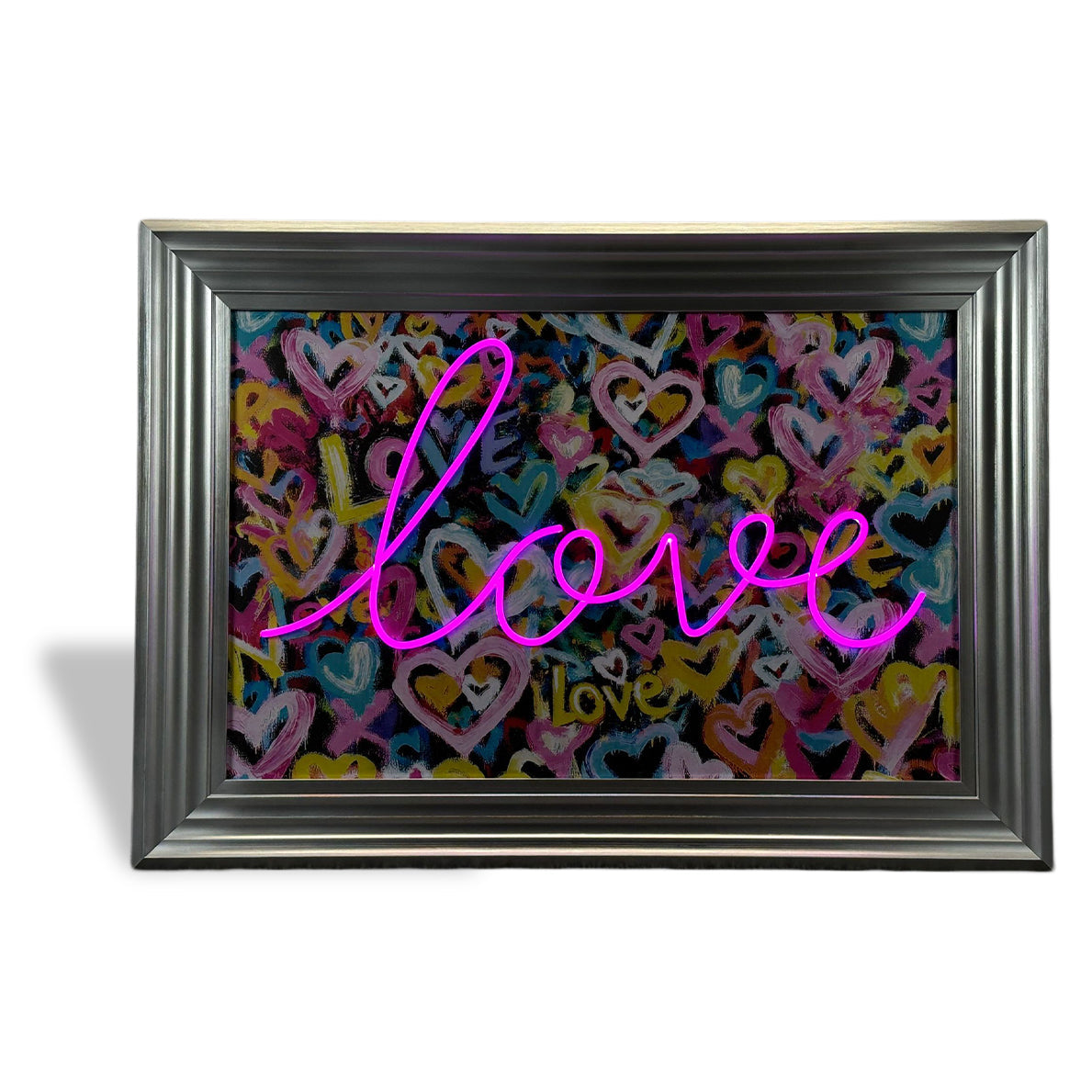 A love solves everything neon pink glowing sign with multicolored hearts in a silver frame for decor or gifts